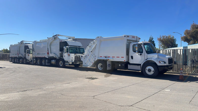 Fleet of refuse trucks lined up